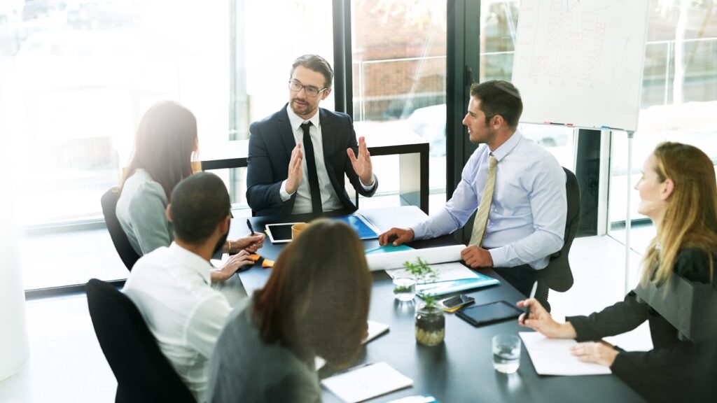 A sales team having a meeting in the office.