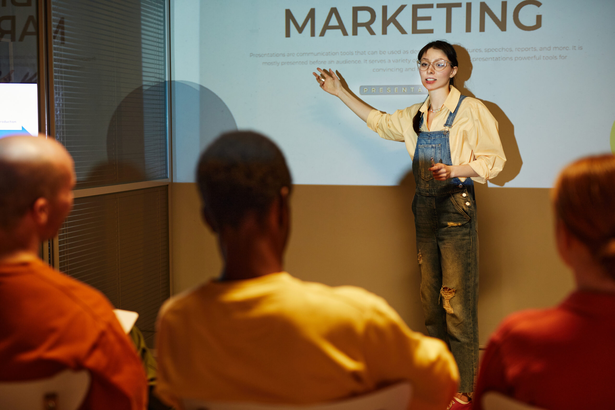 A young professional delivering a marketing presentation